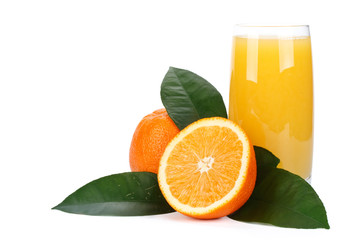 Fruits with green leaves and glass of juice
