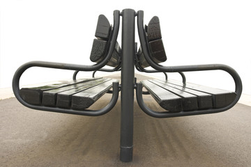 Empty bench at a railway station platform.