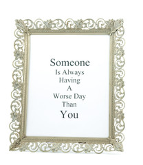 Ornate metal picture frame with message.