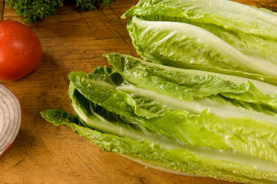 Fresh Crisp Romaine Lettuce On Antique Cutting Board