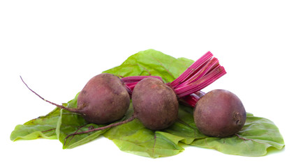 beetroots and their leaves solated on white background