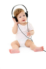 Happy singing baby wearing big black headphones