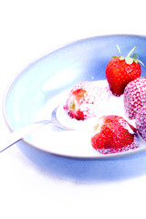 Strawberries and cream with spoon