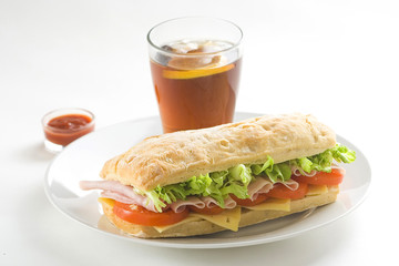 delicious sandwich of ham cheese lettuce tomato