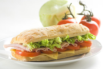 delicious sandwich of ham cheese lettuce tomato