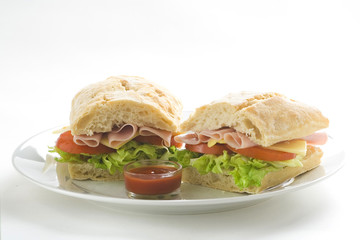 delicious sandwich of ham cheese lettuce tomato