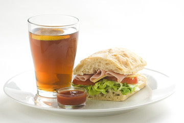 delicious sandwich of ham cheese lettuce tomato