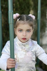 Beautiful caucasian little girl with asian dress