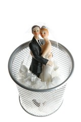 wedding figurine on the paper trash