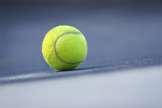 Tennis ball, blue court