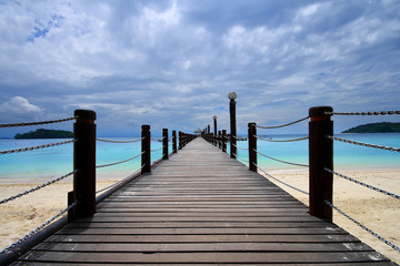 Footbridge over turquoise ocean