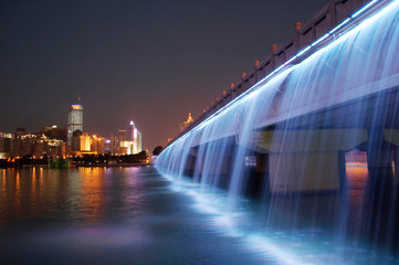 Fototapeta na wymiar splendid bridge with colorful waterfall