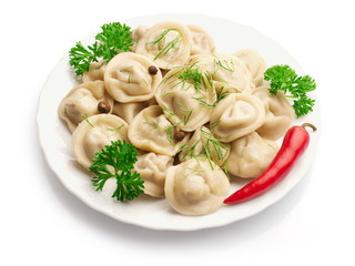 Boiled Ravioli with red pepper over white background