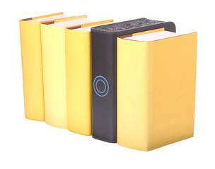 Row of yellow hardback books with a computer hard drive