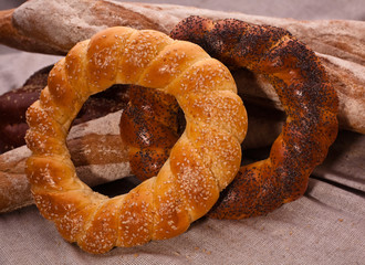 A pair of Bagels covered with sesame and papaver