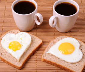 Fried eggs and cup of black coffee