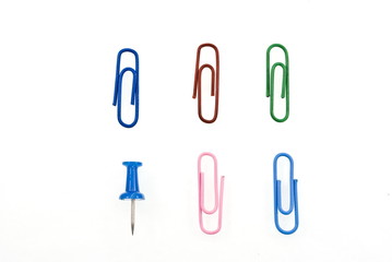 Colorful paper clips and pin
