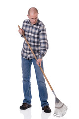 Gardener with a rake