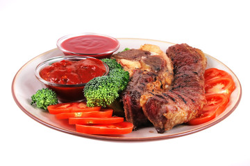 served beef steak and hot chili sauces