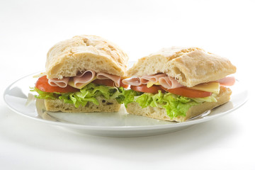 delicious sandwich of ham cheese lettuce tomato