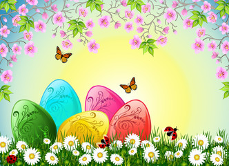 Glossy Easter eggs under cherry tree blossoms