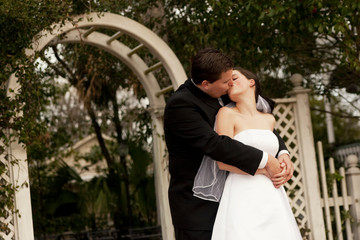 Fototapeta na wymiar newlyweds kissing