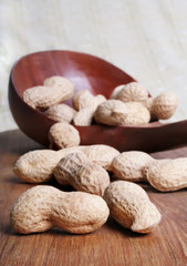 peanut on wooden spoon
