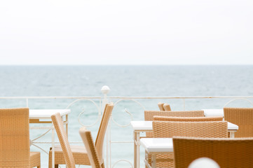 Tables at a restaurant overlooking sea views.