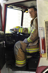 Fire lieutenant sitting in fire truck