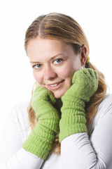 The young girl in warm gloves