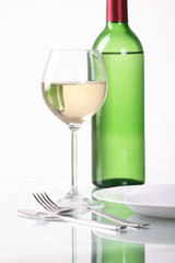 Bottle and glass of  wine  on white background