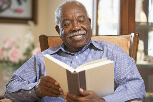 Senior man reading book