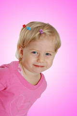 smiling baby girl in pink dress