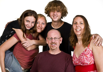 Casual portrait of a happy family isolated on white.