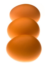 Three backlit eggs in a line