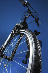 Mountain bicycle on a dark blue background