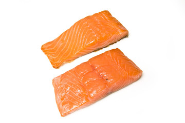 Smoked salmon pieces isolated on a white studio background.