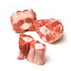 Ox tail chuncks isolated on a white studio background.