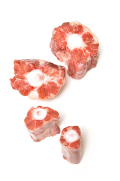 Ox tail meat chuncks isolated on a white studio background.