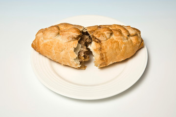 Cornish pasty isolated on a white studio background.