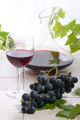Red wine and grapes