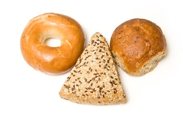 Various bread rolls isolated on a white studio background.
