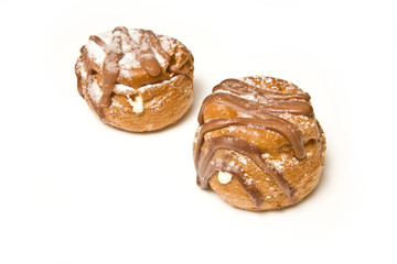 Cream buns isolated on a white studio background.