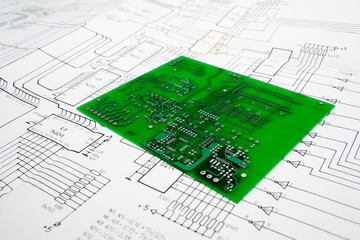 Electronic engineering design table with schematic and pcb - obrazy, fototapety, plakaty