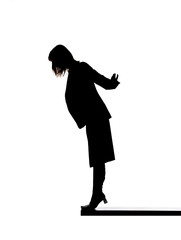 Silhouette of a woman close to fall down