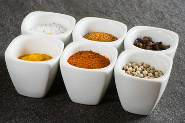 view over several pots with ground spices