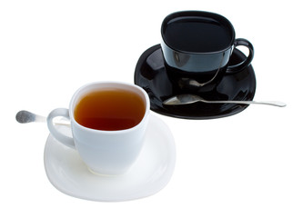white and black cups with tea