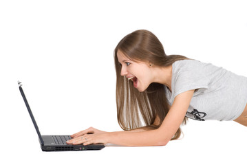 Naklejka premium Surprised girl with laptop