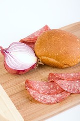 Red Onion, Salami And Bread Roll
