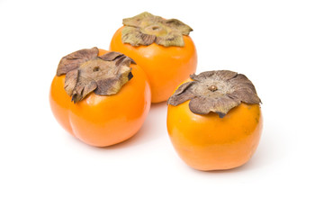 Sharon fruit isolated on a white studio background.